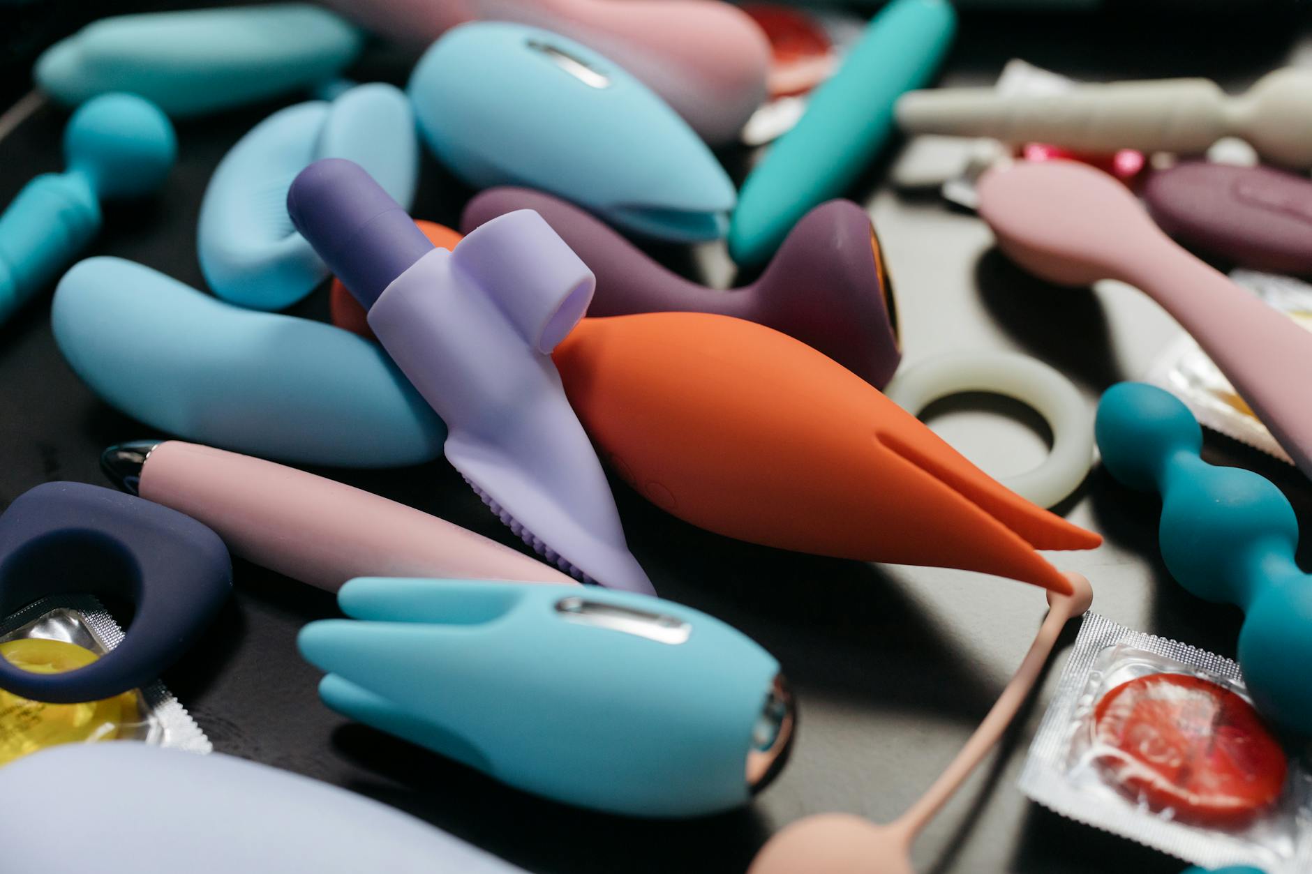 Hands holding a sleek clitoral vibrator, ready for gentle exploration and reconnection.