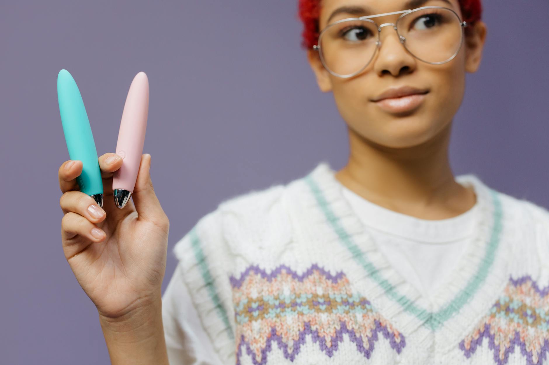 Colorful lemon vibrators and clitoral suction toys displayed against purple background