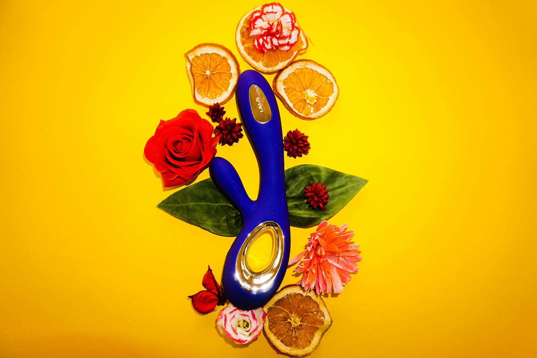 Two hands holding pink and blue silicone vibrators representing reconnection and shared pleasure after long-distance separation