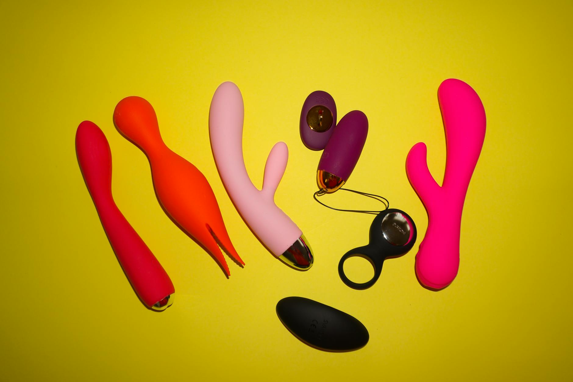 Fresh lemons on a pastel background, symbolizing the Lemon vibrator and natural sensuality